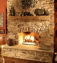 Manufactured stone fireplaces have come a long way in recent years. Their realistic appearance and lower cost make them a viable alternative to natural stone.