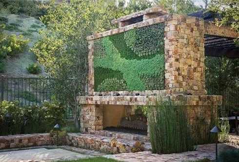 The outdoor patio fireplace designs featured here range from soaring hearths attached to the home