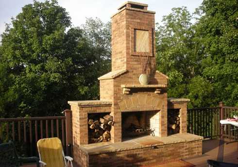 What are some safety tips for using an outdoor fireplace and pizza oven?