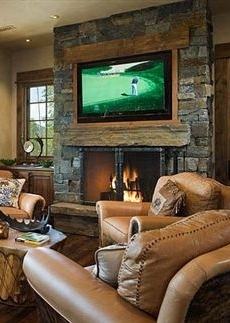 flat screen tv over fireplace