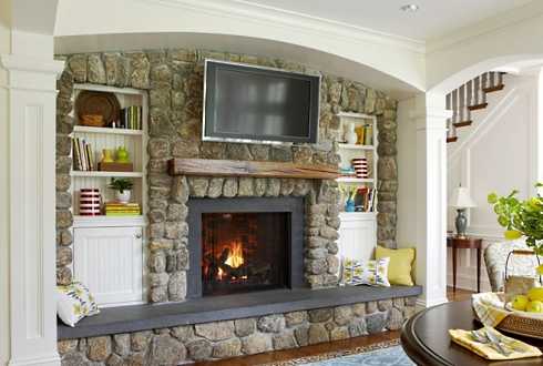 stone surround fireplace with built ins