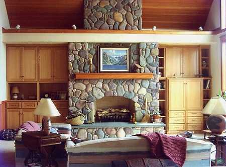 stone surround fireplace with built ins